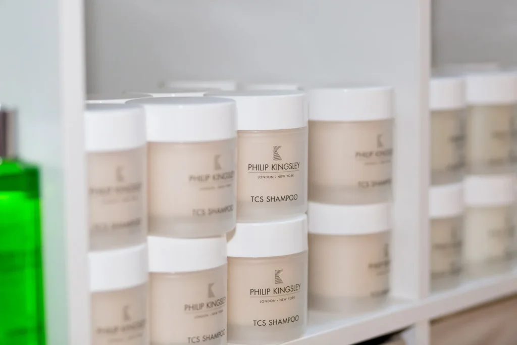 Hair and scalp care products on a clinic shelf